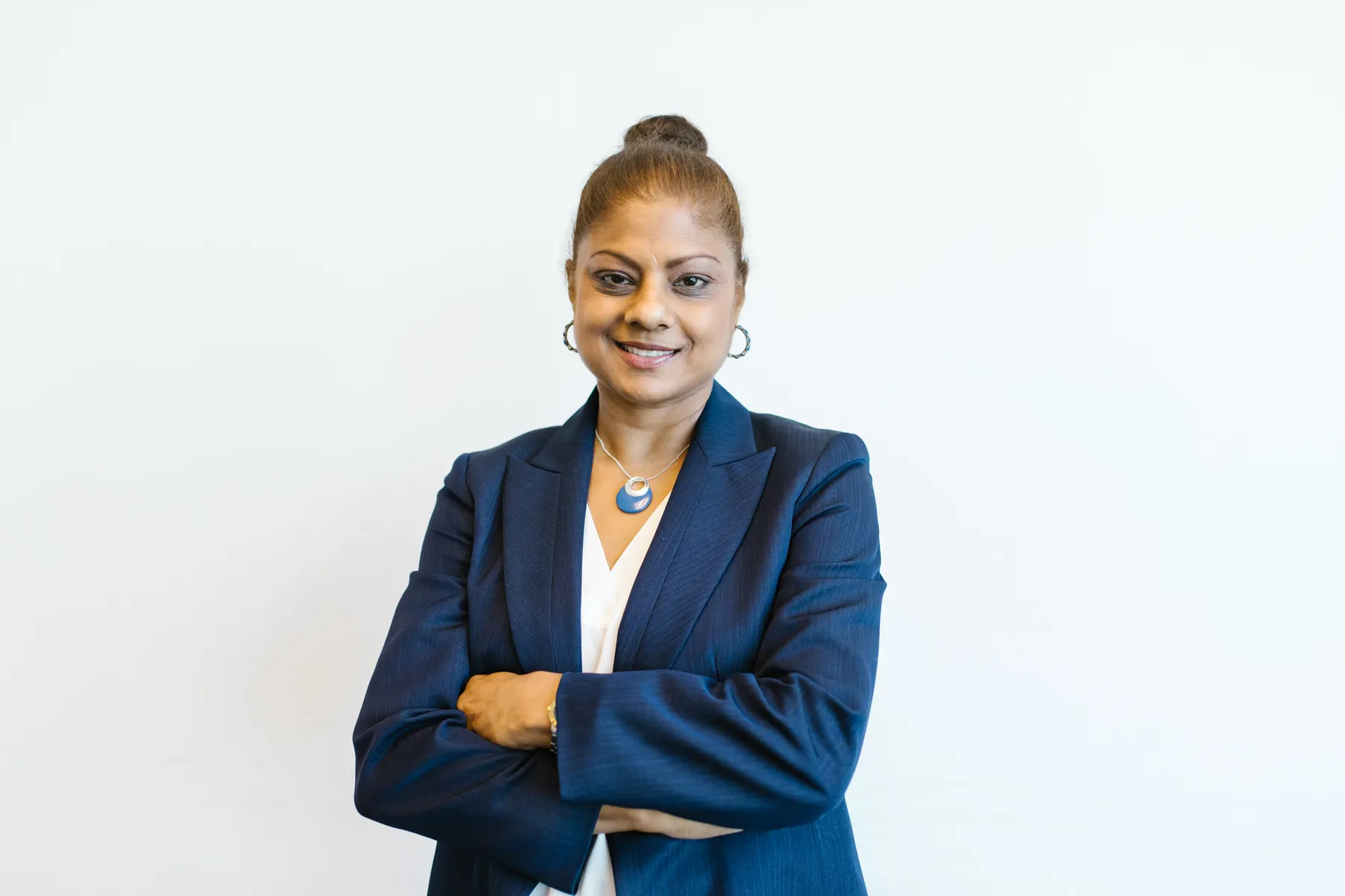 Smiling professional woman in a navy blazer